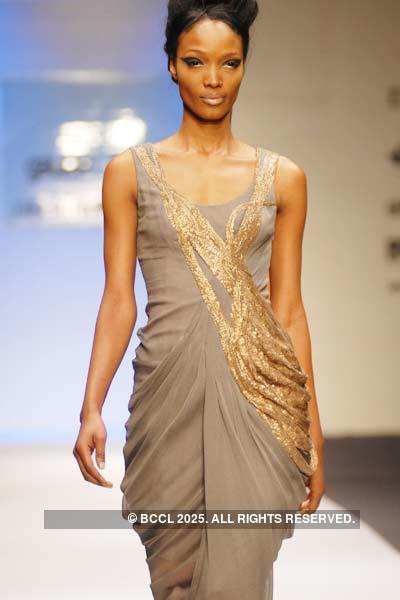 Malvika displays a creation by designer Gaurav Gupta during Delhi ...