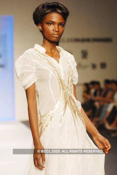 Malvika displays a creation by designer Gaurav Gupta during Delhi ...