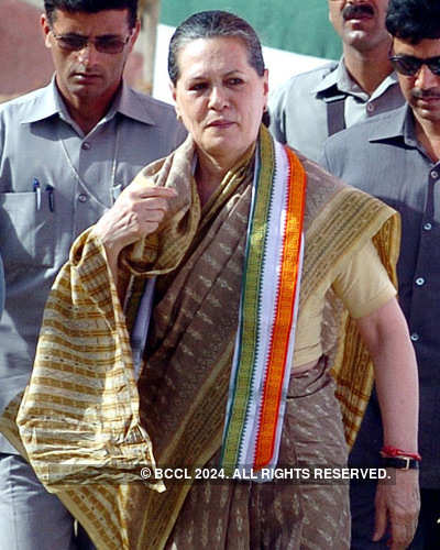 Sonia Gandhi waves to the crowd during an election campaign in Lucknow ...