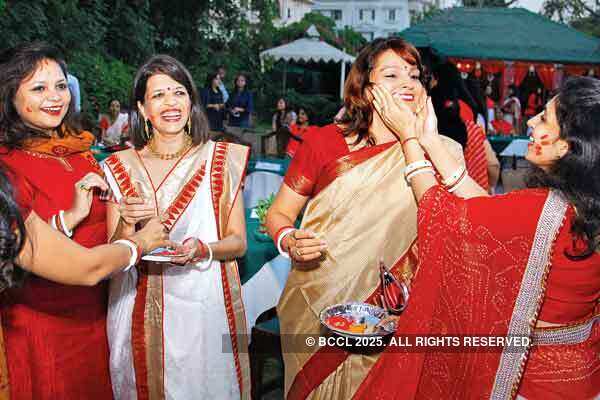 Resplendent in their off white Bengali sari with red borders and traditional finery, the members smeared each other&rsquo;s faces with Sindoor.