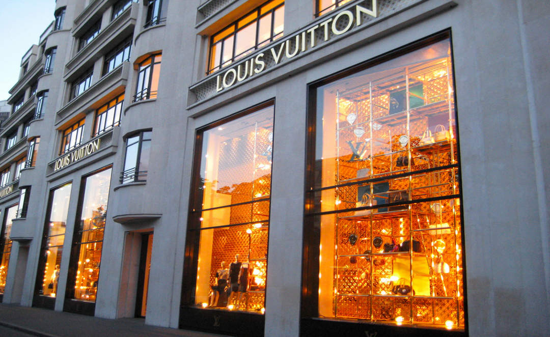Paris, France - Ap 7, 2022: Presentation of beautiful Louis Vuitton  sunglasses in decorate showcase in French city with customer reflection  taking photo Stock Photo
