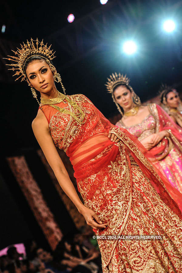 Models showcase a creation by designer Suneet Varma during the Blenders ...