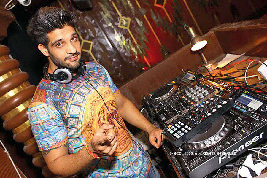 DJ Yogi poses during a party  Photogallery - Times of India