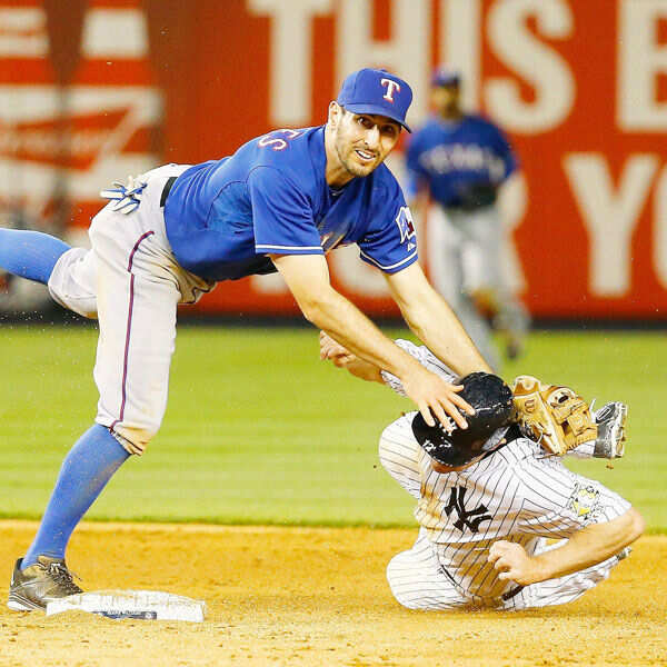 Adam Rosales #9 of the Texas Rangers attempts to turn a Photogallery - Times of India