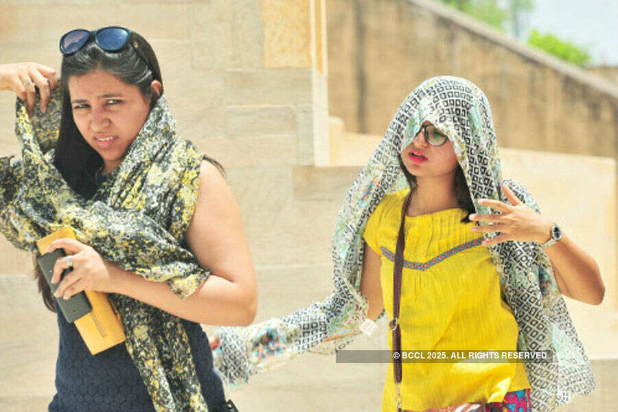 Girls try to cover themselves with scarfs Photogallery - Times of India