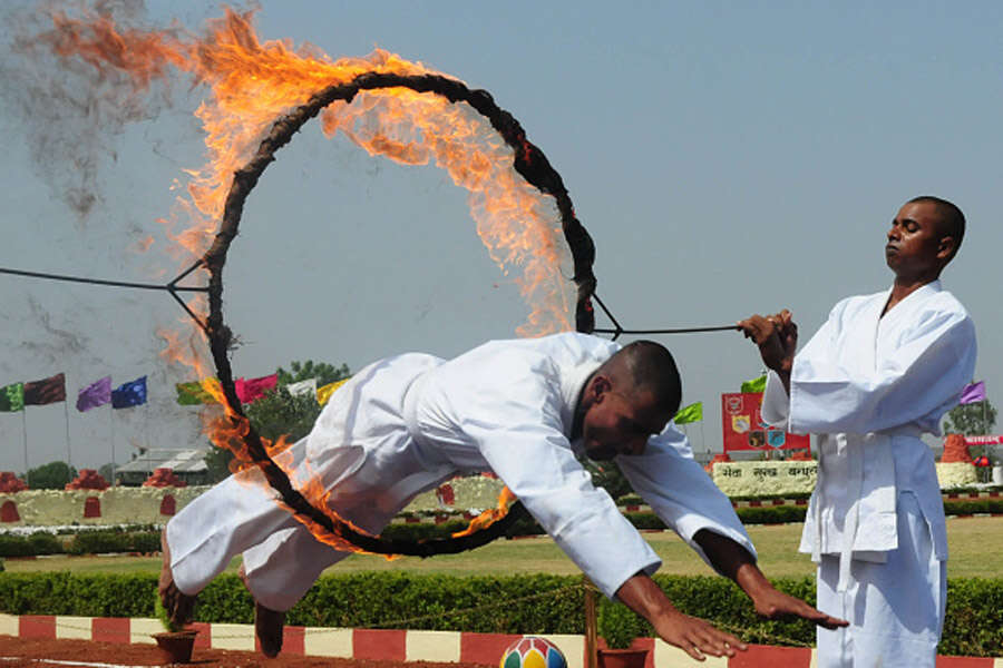 Sashastra Seema Bal (SSB) jawan passing through fire ring during passing out parade Photogallery - Times of India