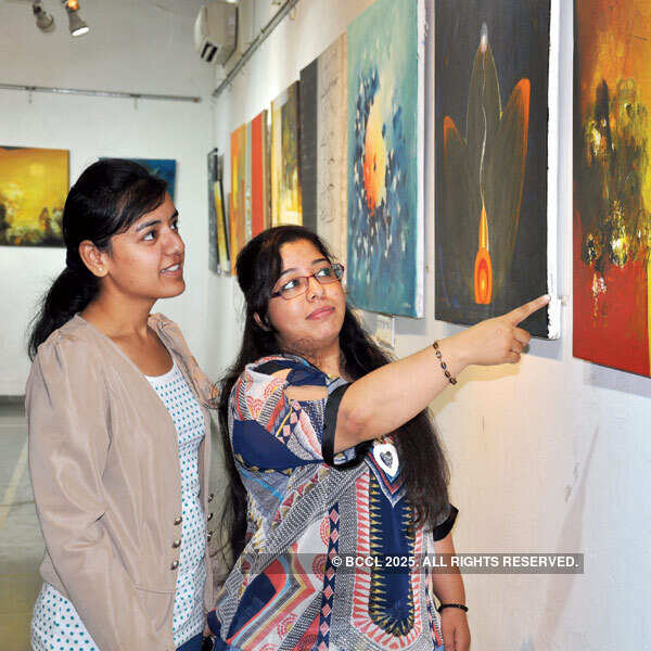 Guests at the art exhibition Photogallery Times of India