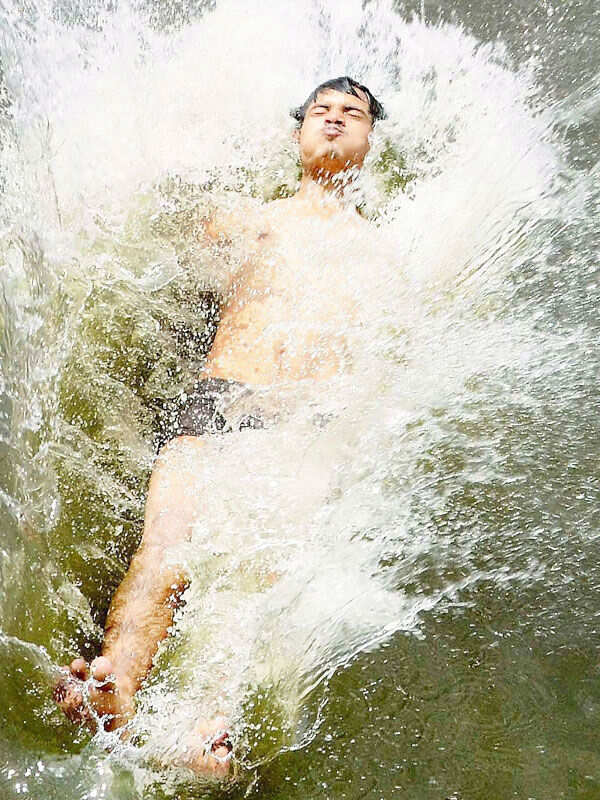 A boy cool himself in the Lower Lake Photogallery - Times of India