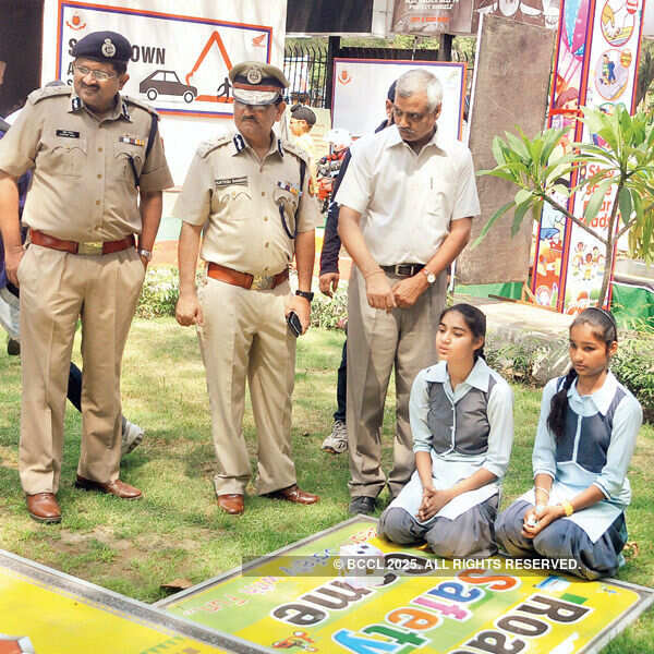 Muktesh Chander, special commissioner of police (Traffic) and Satyendra Garg, joint commissioner of police, general administration, interacting with kids  Photogallery - Times of India
