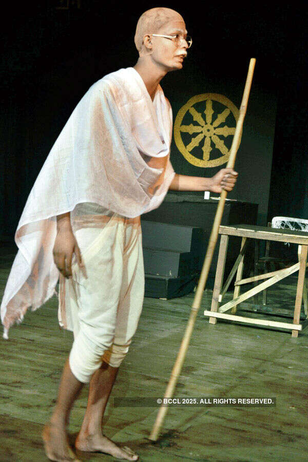 An artist performs during a play Gandhi Ne Kaha