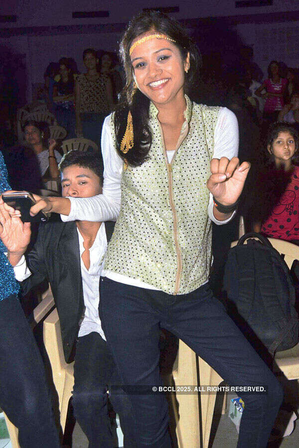 A girl shakes a leg during an event