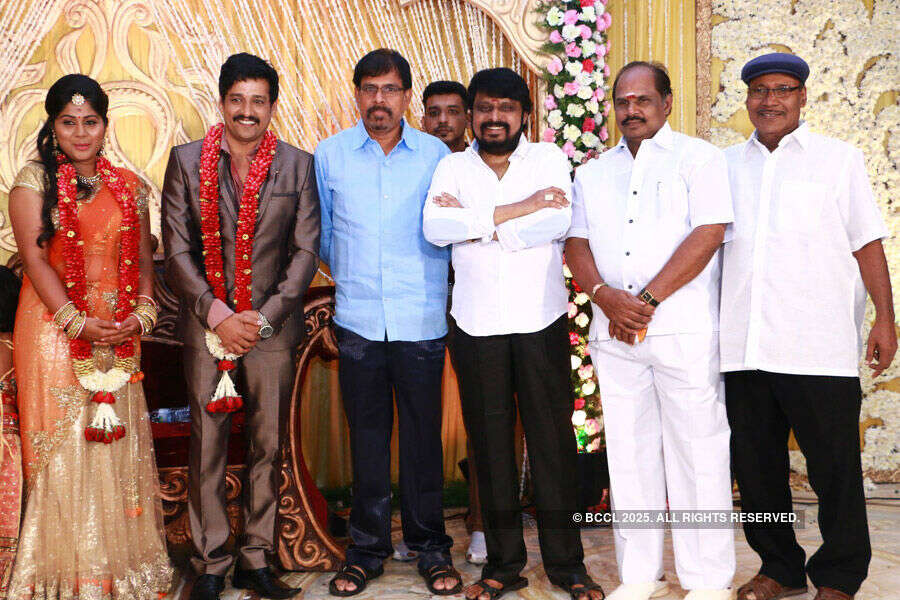 Gayathri Devi pose with guests during their wedding reception