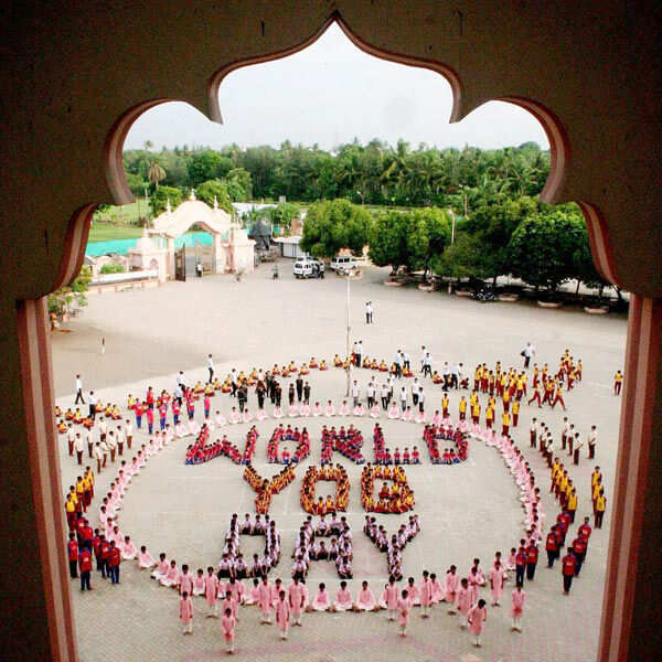 Students performing Yoga