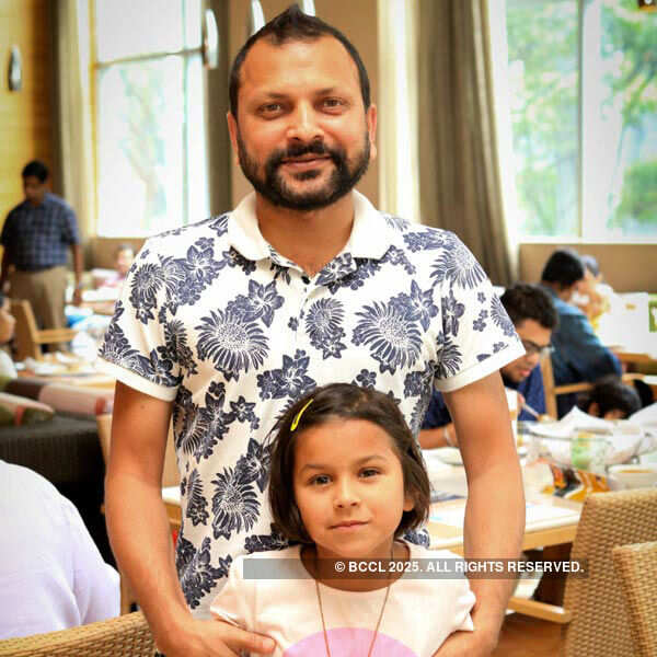 Sanjay poses with his daughter Mia