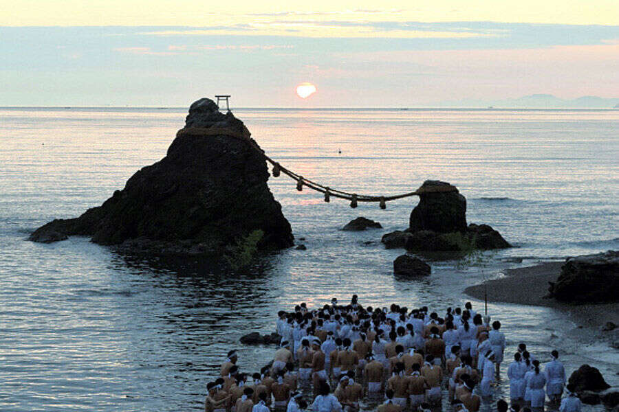 Some 200 people wearing white clothes