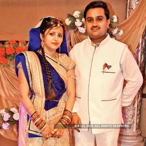 Navnee and Sachin pose during the wedding reception party