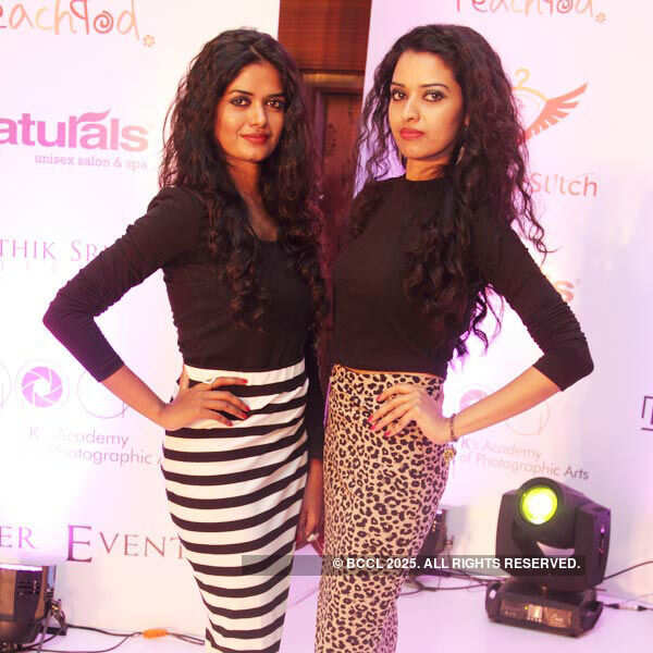 Sowbaraniya and Amala pose for a photo during a fashion show
