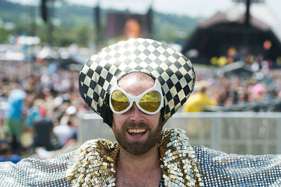 Festival goers enjoy the sunshine