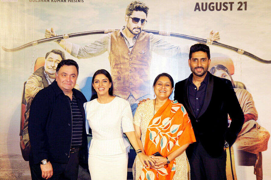 Indian Bollywood actors Rishi Kapoor (L) and Abhishek Bachchan (R) pose with actresses Asin Thottumkal (2L) and Supriya Pathak (2R)during the trailer launch