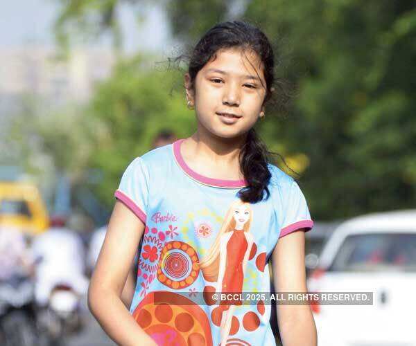 A youngster takes to her scooter during the Raahgir day in Bhopal