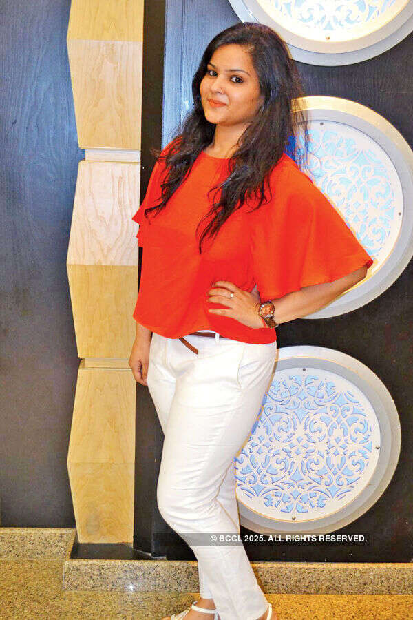 Shubhi poses during a party