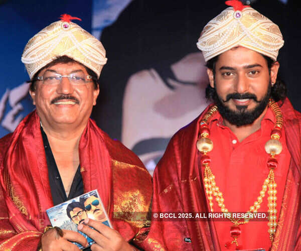 Devaraj and his son Prajwal during the audio launch