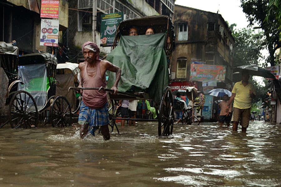 Heavy rains trigger floods in east, west India