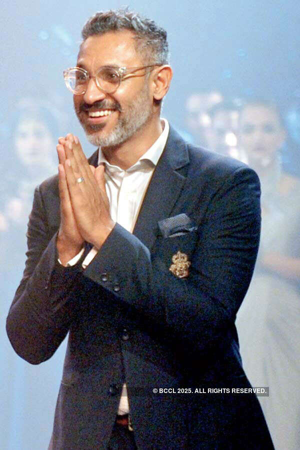 Designer Nikhil Mehra walks the ramp after showcasing his creations