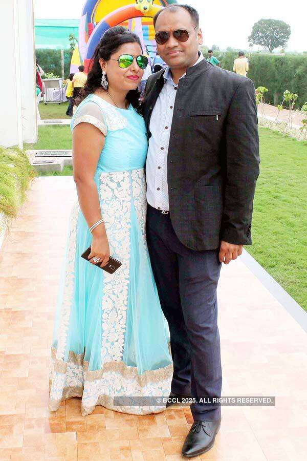 Amita and Ravi Agrawal pose for a photo during his party