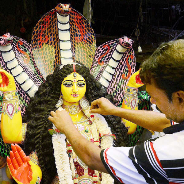 An artist giving finishing touch to idol