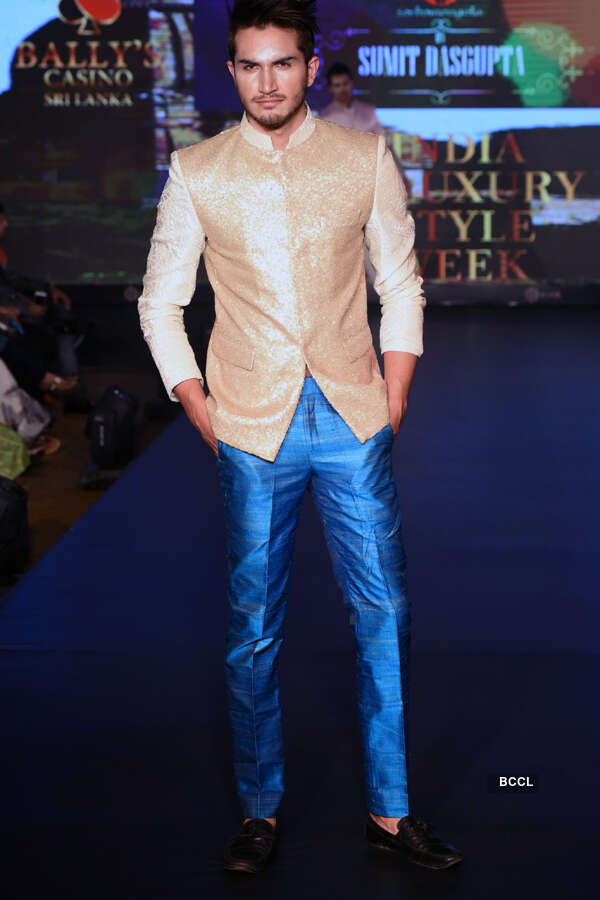 A model walks the ramp on Day 5