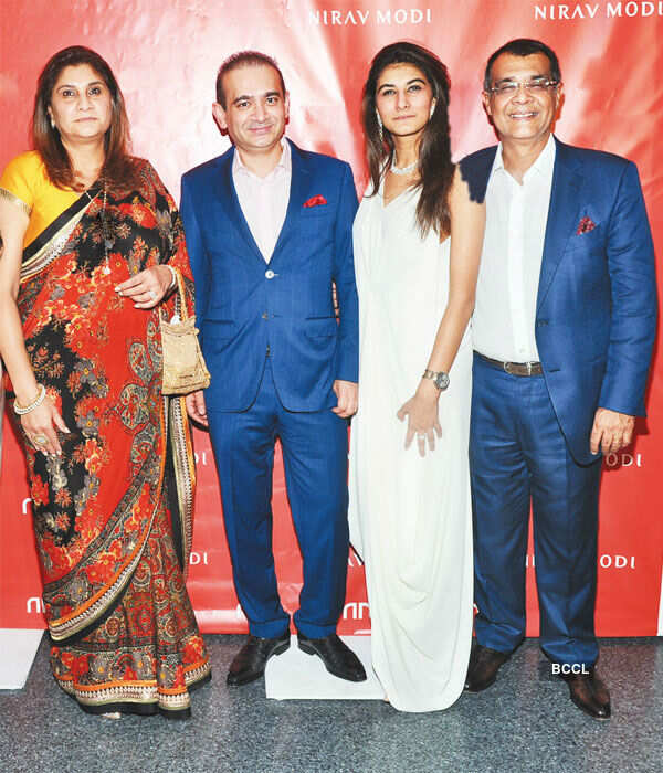 Designer Nirav Modi (2L) poses with friends