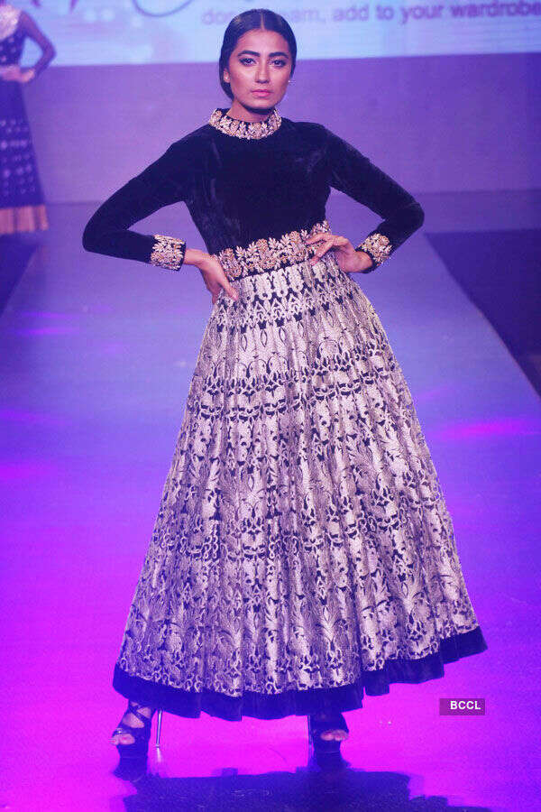 ​​A model walks the ramp during a fashion show