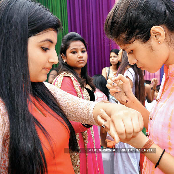 Kritika (L) and Saloni at the tattoo stall