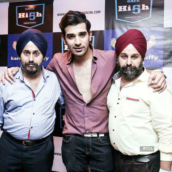 ​Designer duo Ravinder and Tejinder Singh pose with a friend