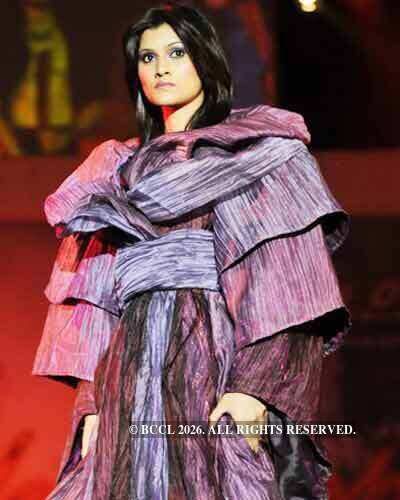 A student walks the ramp during the fashion show 'Kaleidoscope' as part ...