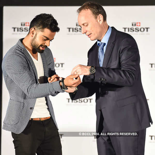 Virat Kohli poses for a photo during his appointment as the brand