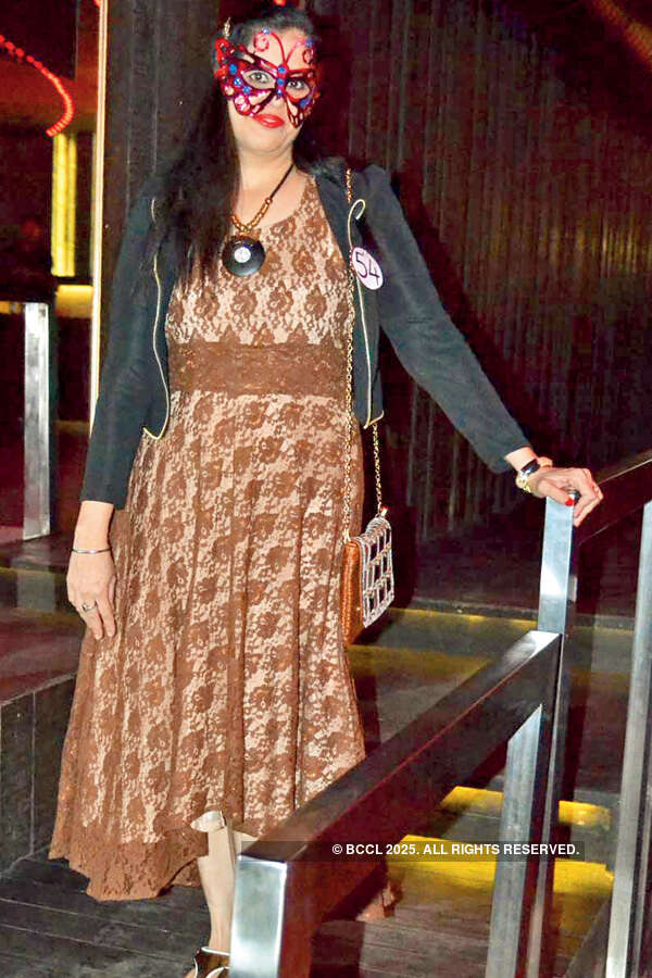 Socialites at masquerade party