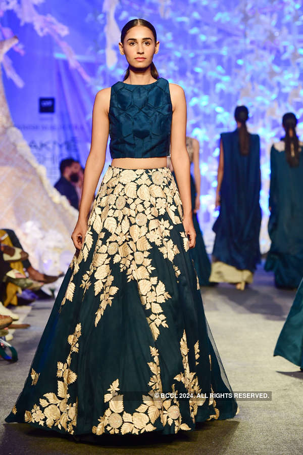 A model showcases a creation by designer Manish Malhotra during the ...