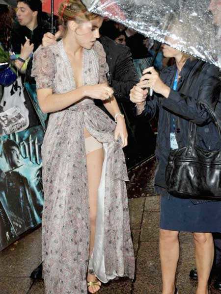 Harry Potter' star Emma Watson suffered a wardrobe malfunction as her frock  slipped at the rain soaked premiere of 'Harry Potter the Half-Blood Prince'  in London - Photogallery