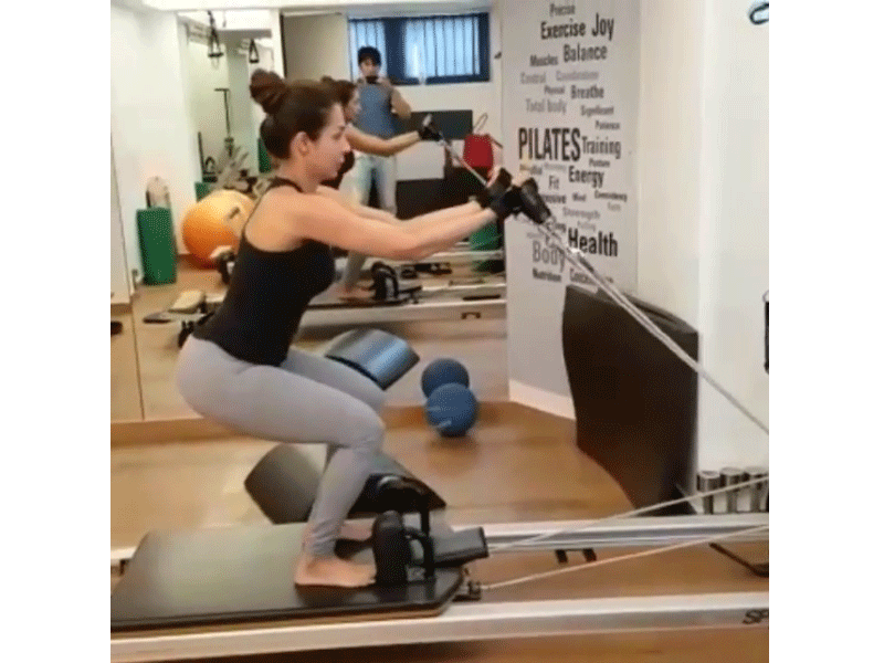 Malaika sweats it out in the gym