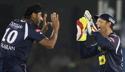 Adam Gilchrist of Deccan Chargers celebrate victory with teammate Jaskaran Singh