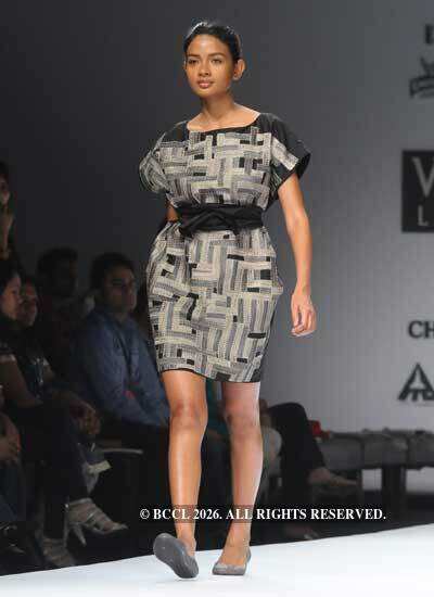 A model presents a creation by designers Gaurav and Ritika on Day 2 of ...