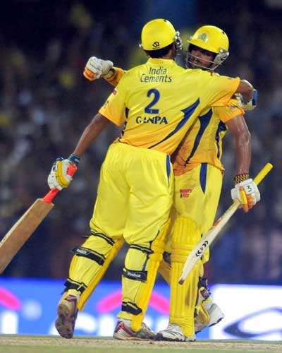 Ganapathy Chandrasekhar of Chennai Super Kings congratulates team mate Suresh Raina after winning the 2010 DLF Indian Premier League T20 group stage match between Chennai Super Kings and Royal Challengers Bangalore played