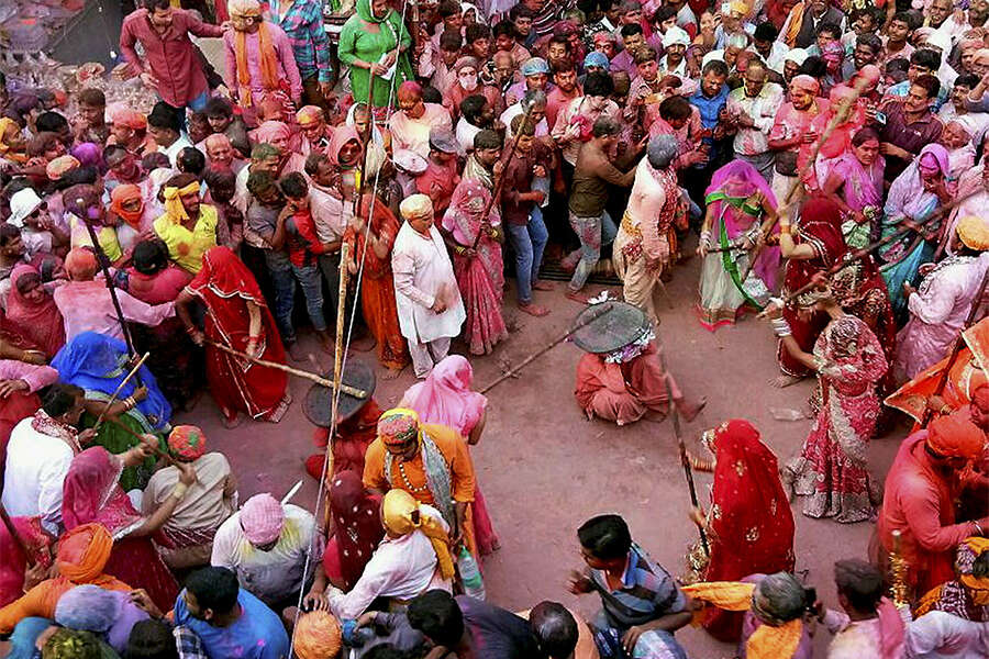 Devotees Play Lathmar Holi