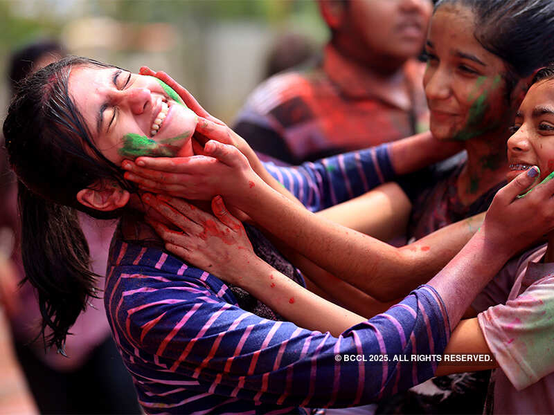 Girls smear colours each other