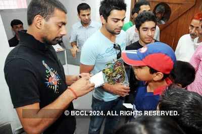 Praveen, Virat felicitated