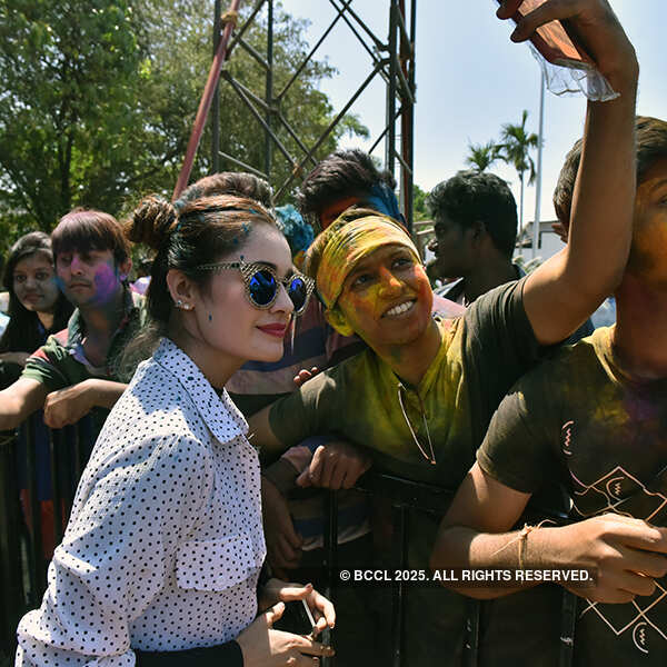 Yuvika Chaudhary poses for a selfie with a fan