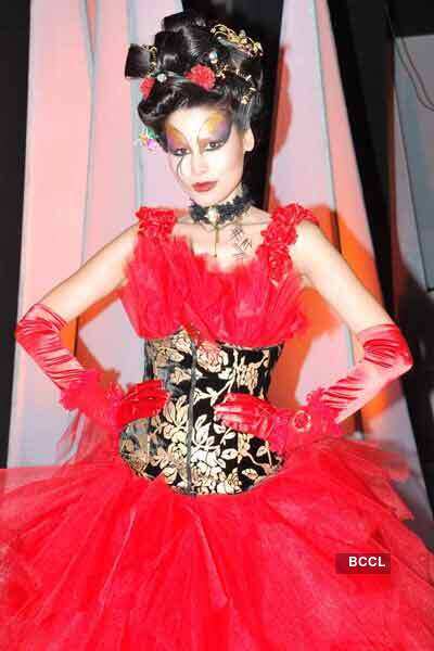 A model showcases a creation during a fashion show organised for the ...