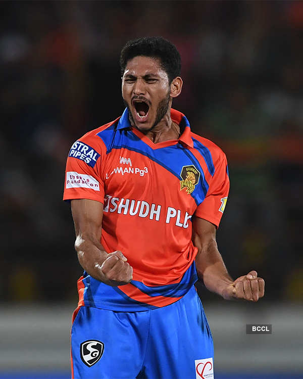 Gujarat Lions cricketer Basil Thampi celebrates the wicket of